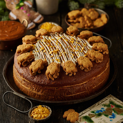 gingerbread cake with ginger frosting finished with mini gingerbread man biscuits
