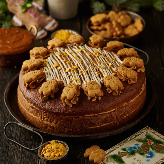 gingerbread cake with ginger frosting finished with mini gingerbread man biscuits