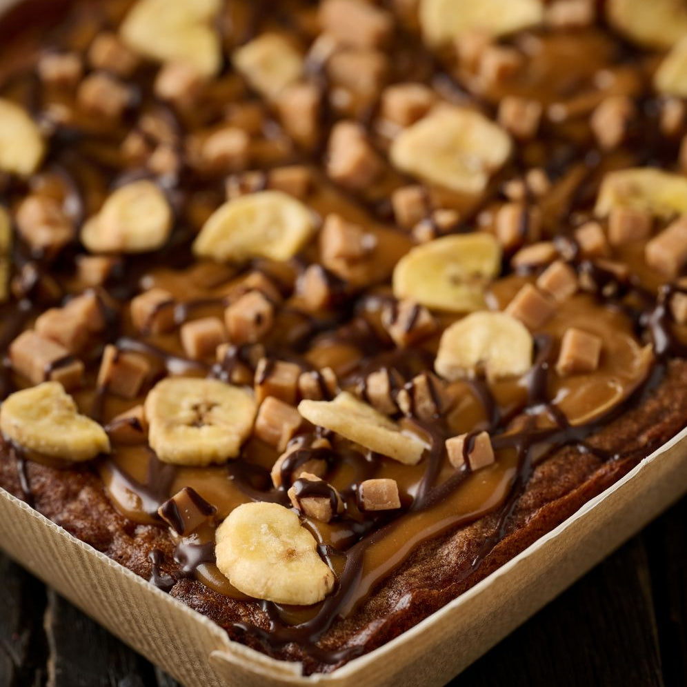 close up of banoffee tart with caramel, fudge and chocolate