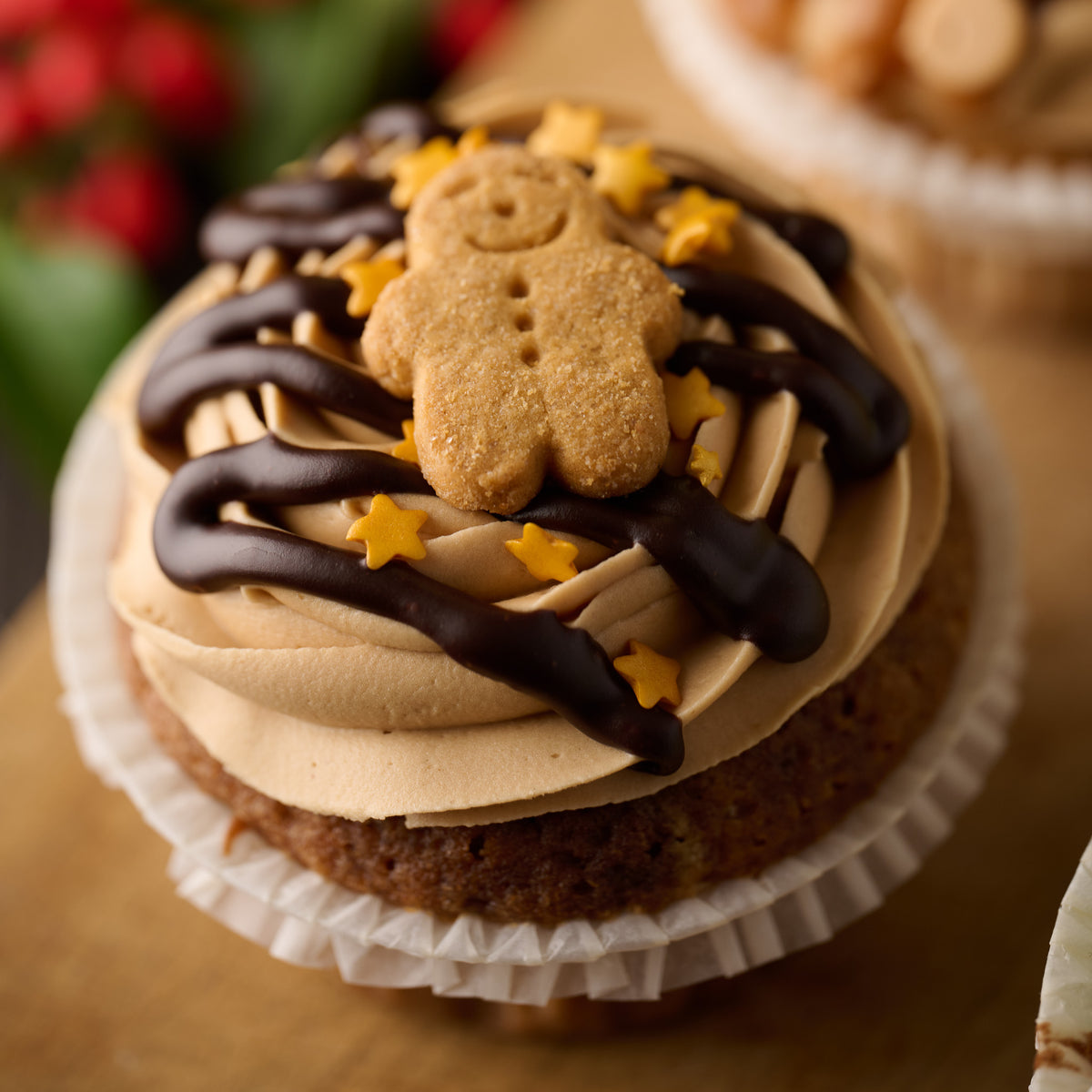 christmas gingerbread cupcake topped with a mini gingerbread man