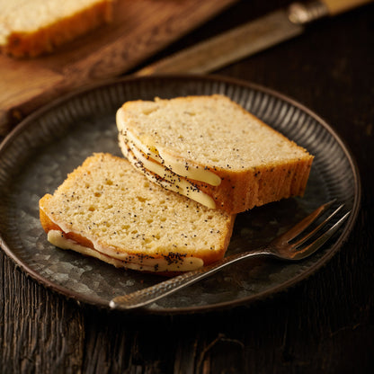 two slices of lemon and poppyseed loaf cake on a plate