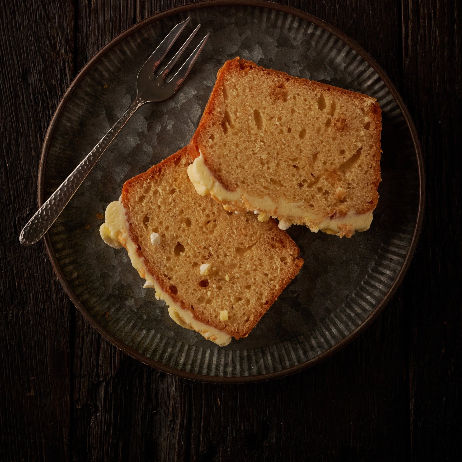 two slices of st clements loaf cake on plate 