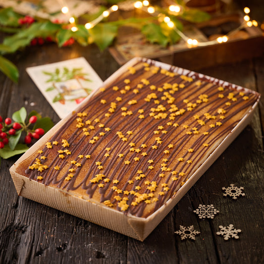 mincemeat and toasted marzipan tart finished with chocolate drizzle and gold stars