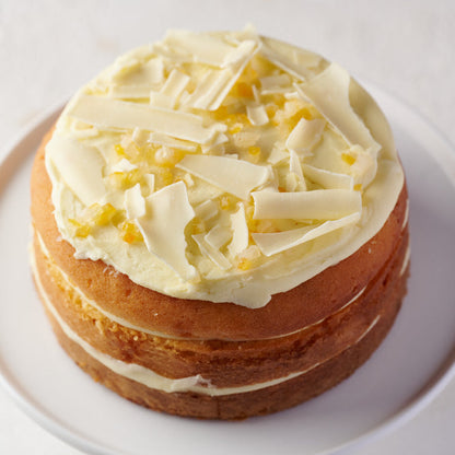 st clements cake with citrus peel and white chocolate shavings