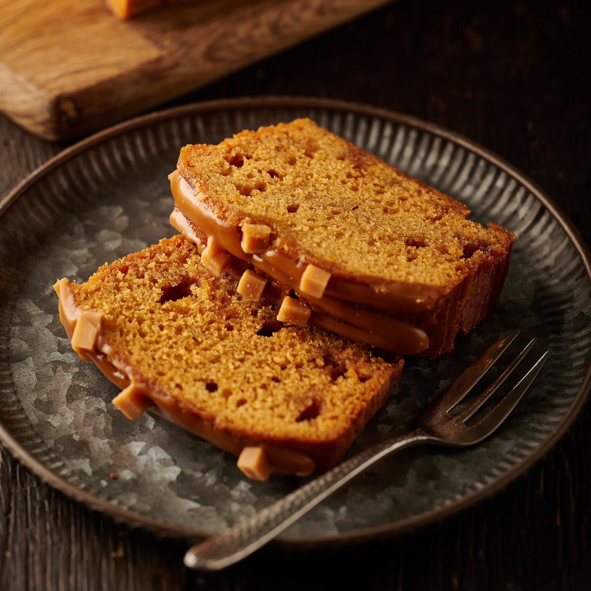 sticky toffee loaf cake slices on a plate