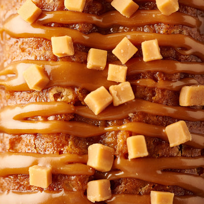sticky toffee loaf cake close up with caramel and fudge
