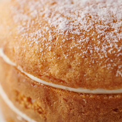 Close-up of a layered cake with a sugary topping