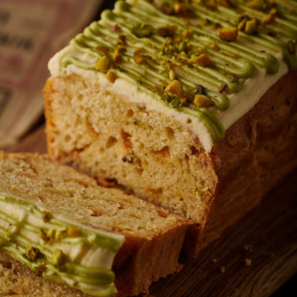 white chocolate and pistachio loaf cake sliced